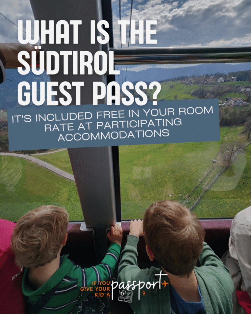 What is the Südtirol Guest Pass? It's included free in your room at participating accommodations. Photo of two boys sitting down looking out of the window of a cable car above Bolzano, Italy.