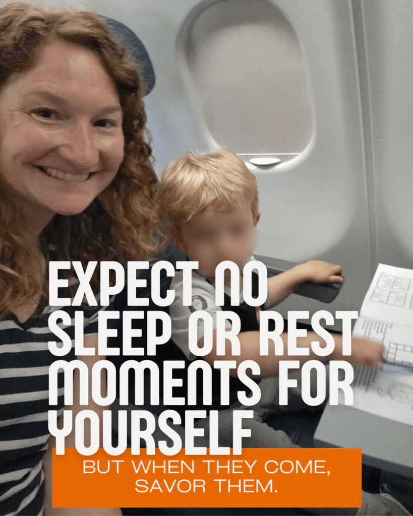 Mom smiling with toddler on airplane holding activity sheet, flying with a toddler tips for parents expecting no sleep