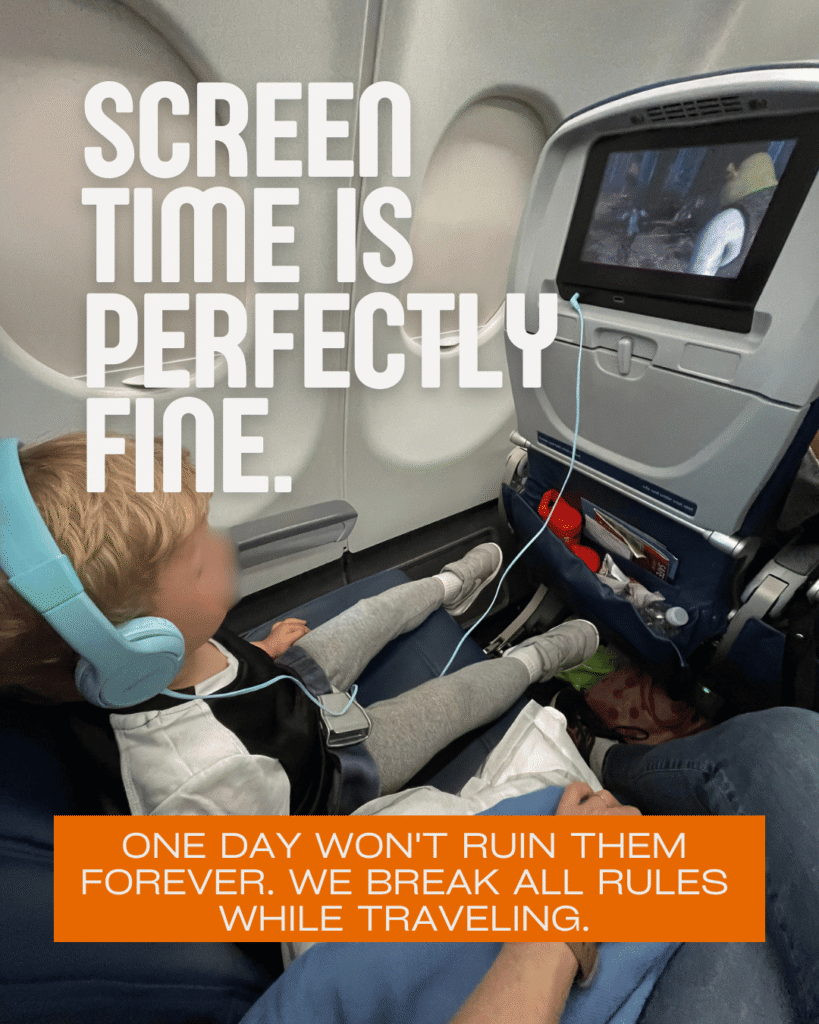 Toddler wearing blue kids headphones watching seatback screen on airplane, screen time rules for toddlers on flights